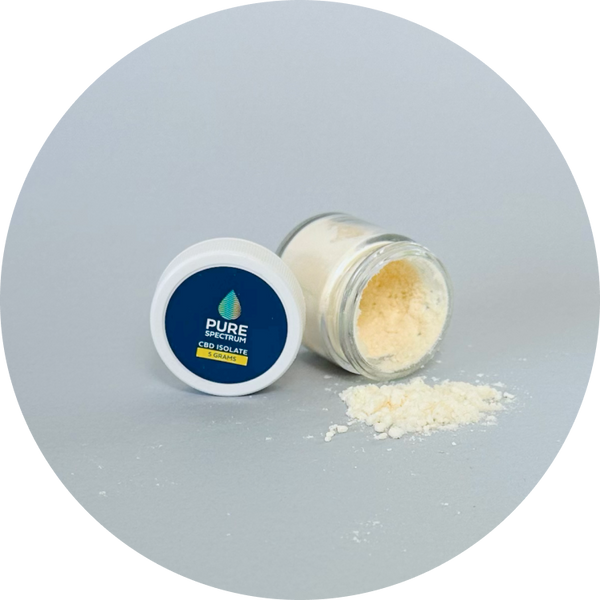 CBD isolate powder jar spilled with product visible