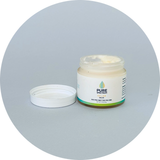 Glass jar of Pure Spectrum CBD Relax Salve with lavender